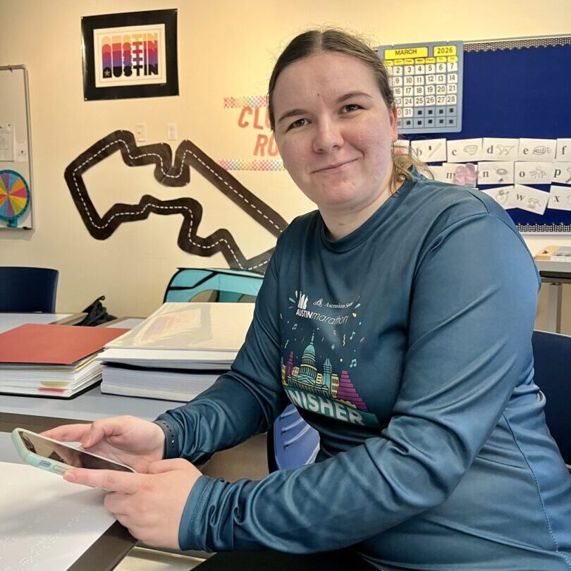 Woman using her cell phone to text.